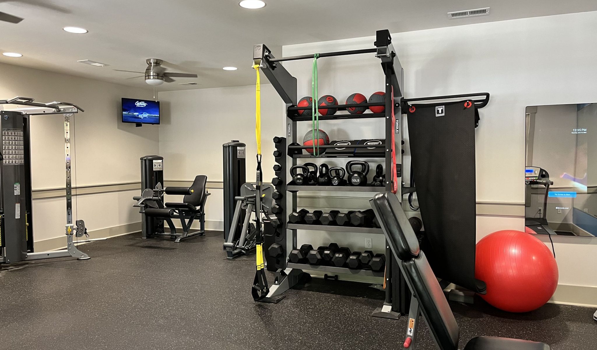 The Townhomes at Chapel Watch Village fitness center with strength training equipment