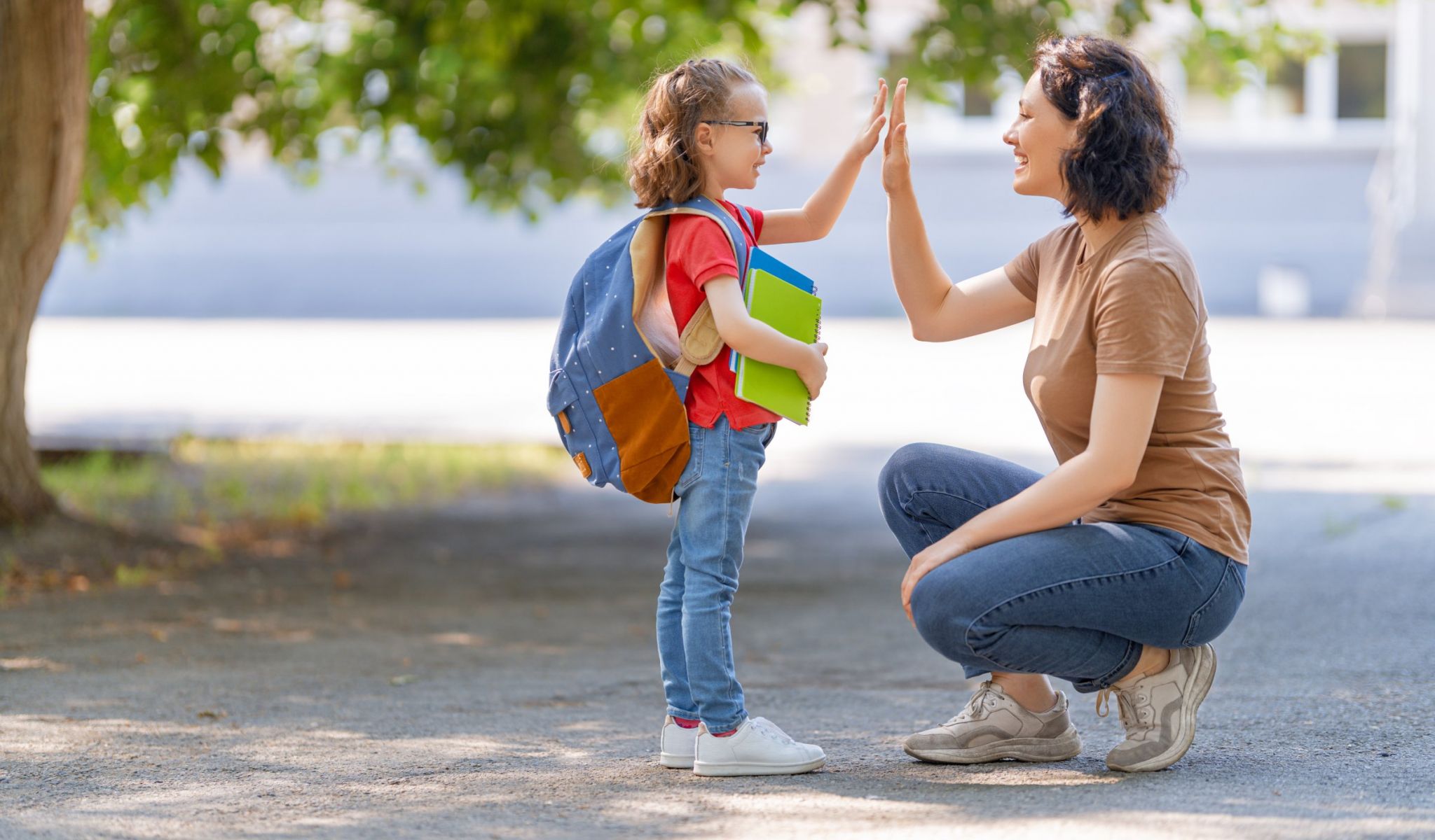 The Townhomes at Chapel Watch Village in Chapel Hill, NC with a young girl going to primary school and saying goodbye to her mother