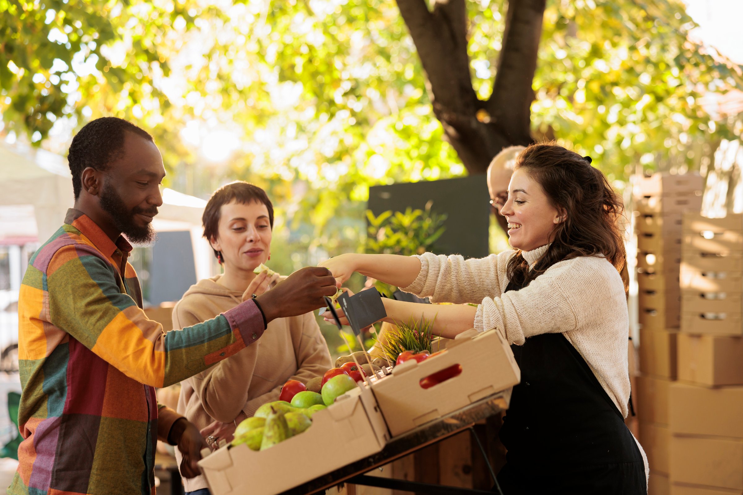 The Townhomes at Chapel Watch Village in Chapel Hill, NC with people shopping at a farmers market